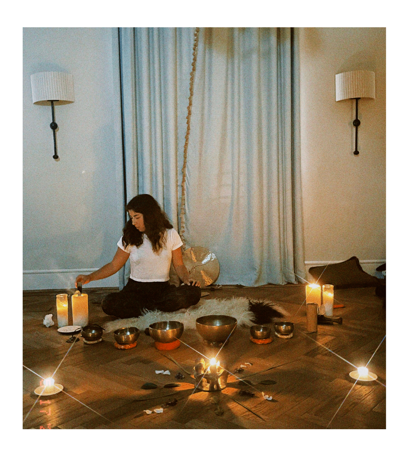 Goni preparing a ceremony with candles and singing bowls